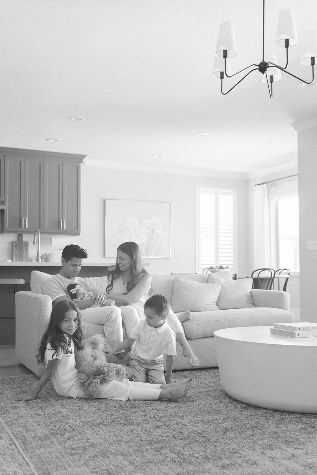 A family of five in black and white newborn session