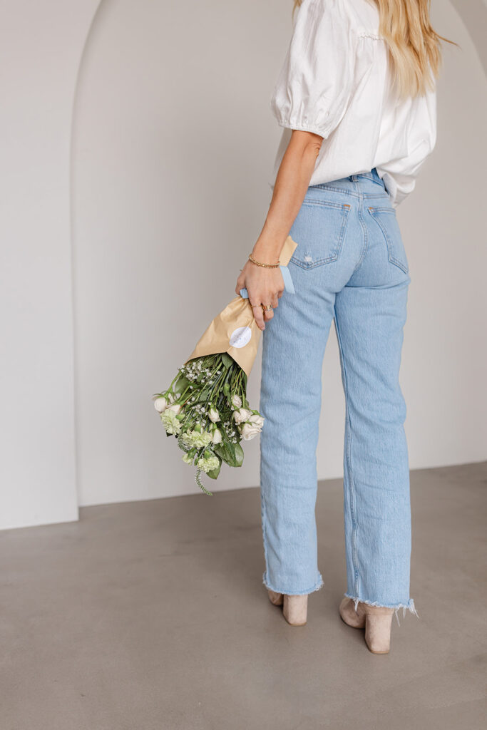 Sacramento brand photography a woman holding a bouquet of flowers