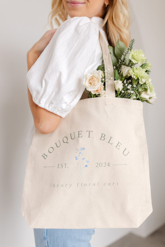 Sacramento brand photography a woman holding a bag full of flowers