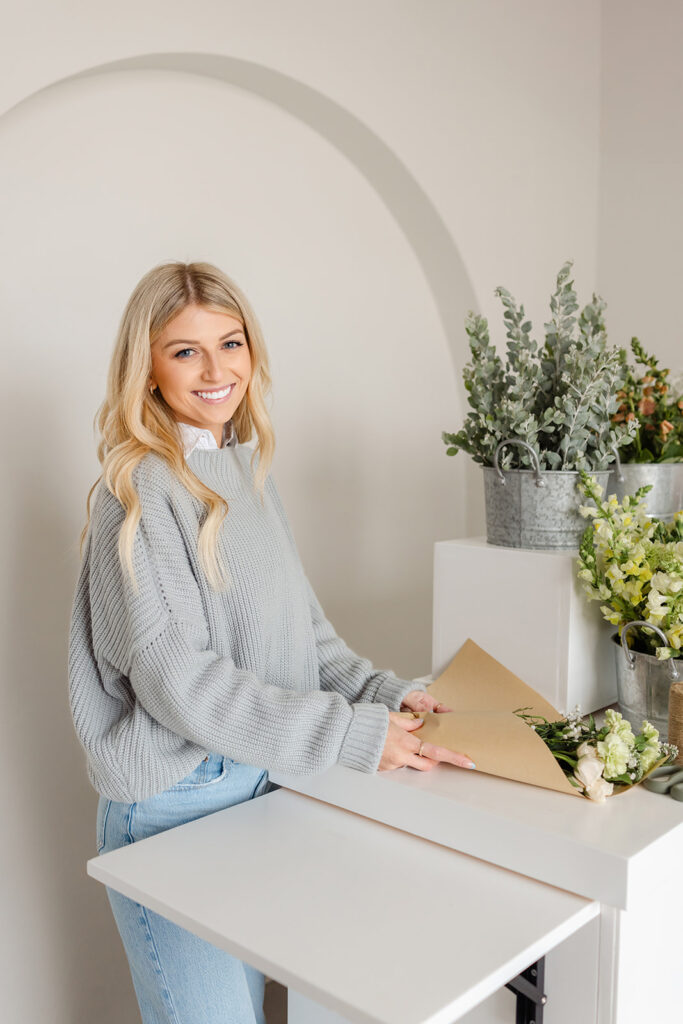 Sacramento brand photography a woman holding a bouquet of flowers