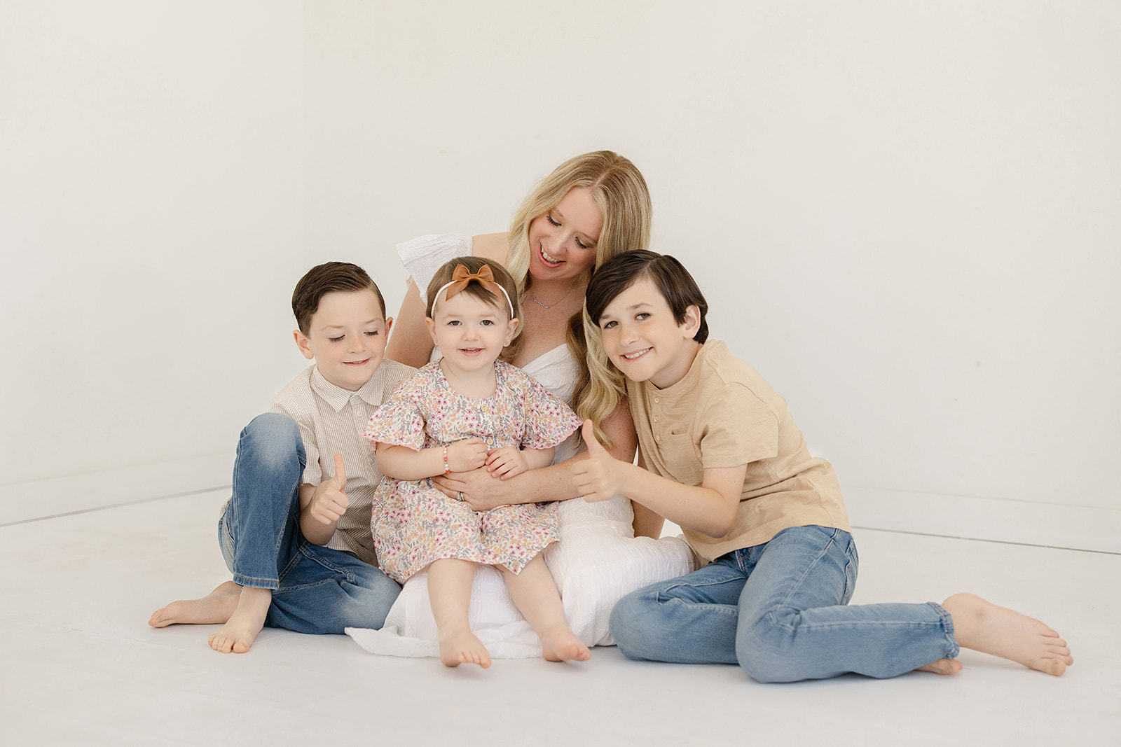 Ripon Studio Motherhood a woman and children sitting on the floor