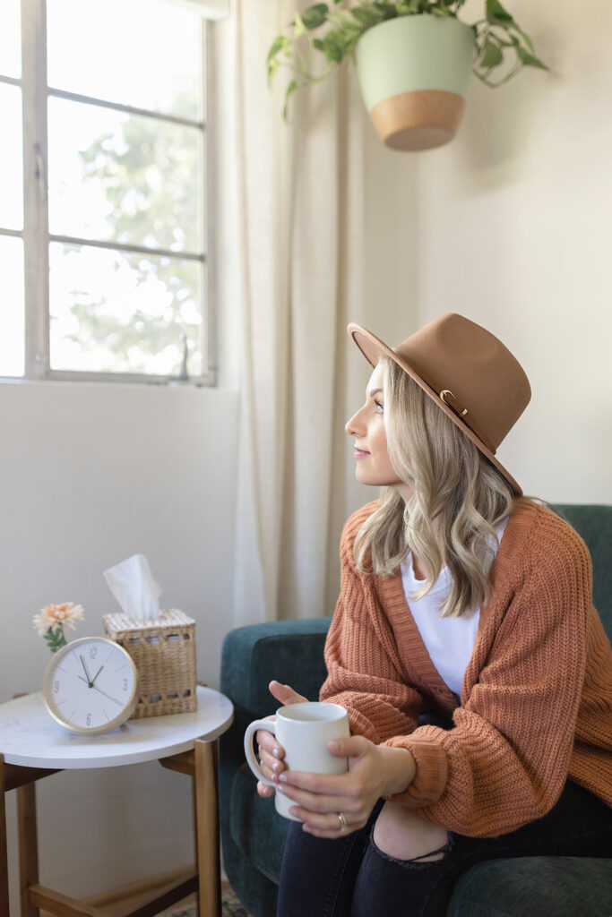 a therapist holding a cup