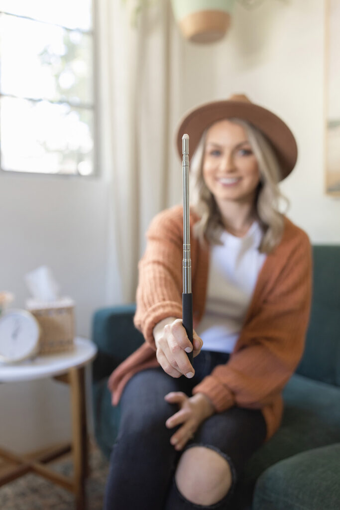 a woman holding a selfie stick