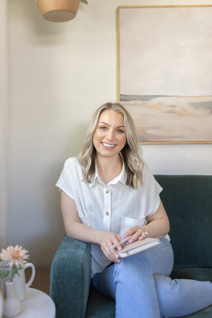 a woman sitting on a couch smiling