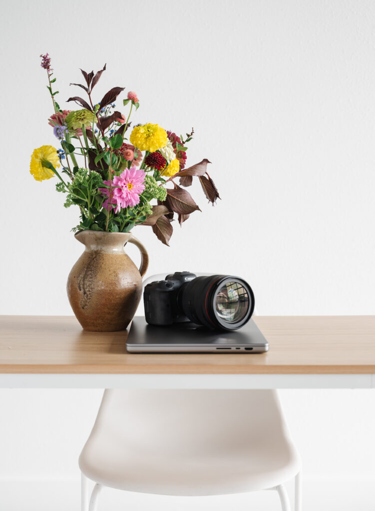 Camera and flowers on a table