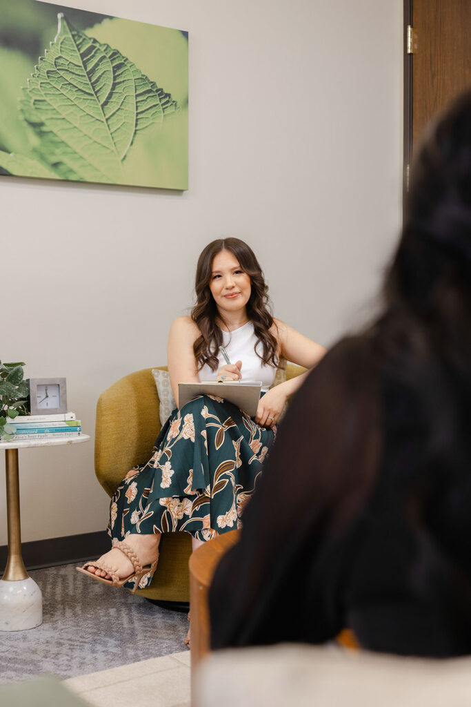 LMFT in Sacramento during a therapy session — brand photography showing therapist listening to client