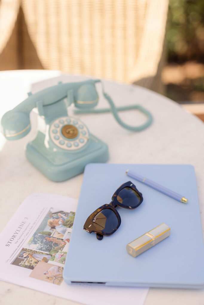 Brand photography props for a Sacramento branding session — branded bag, drink, sunglasses, and lipstick
