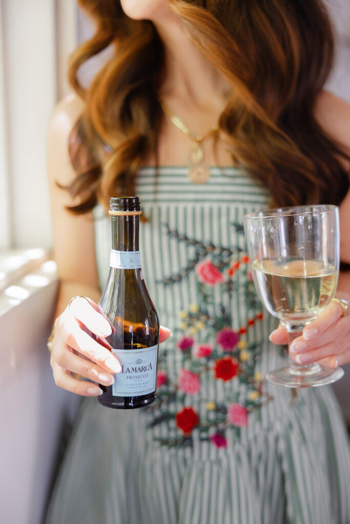 Female entrepreneur with champagne Sacramento branding photographer