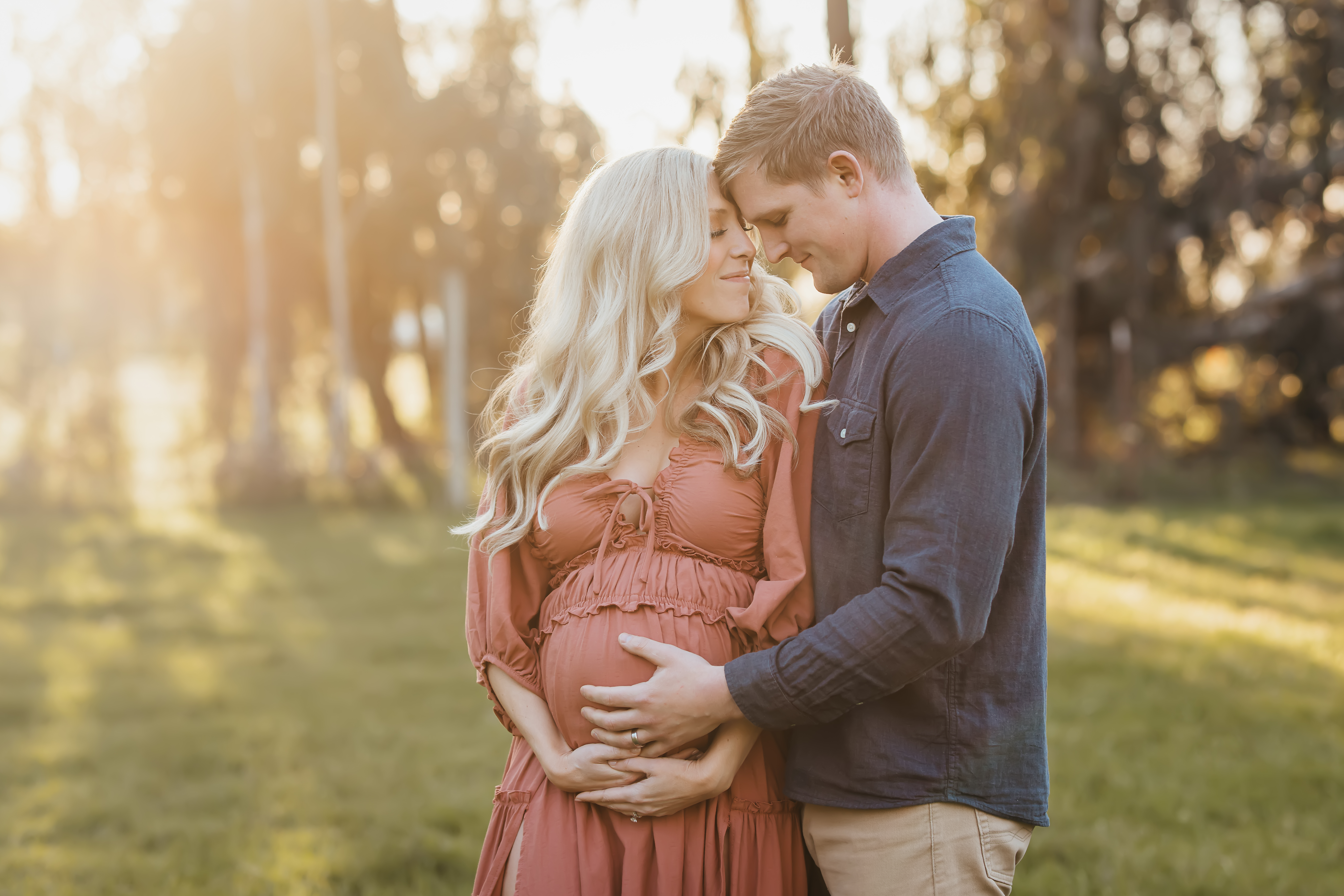maternity session in a field reclamation dress