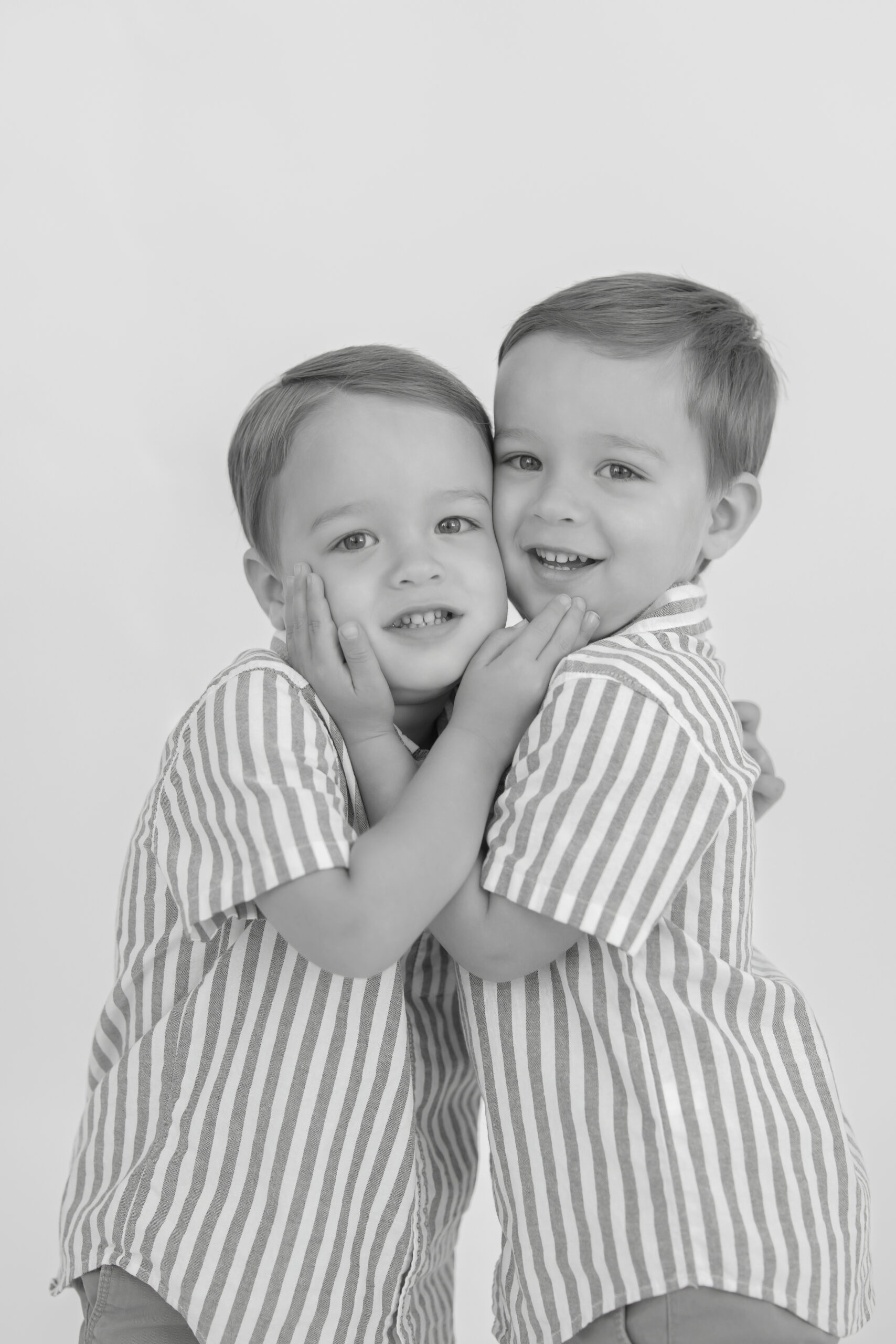 twin boys in matching outfits