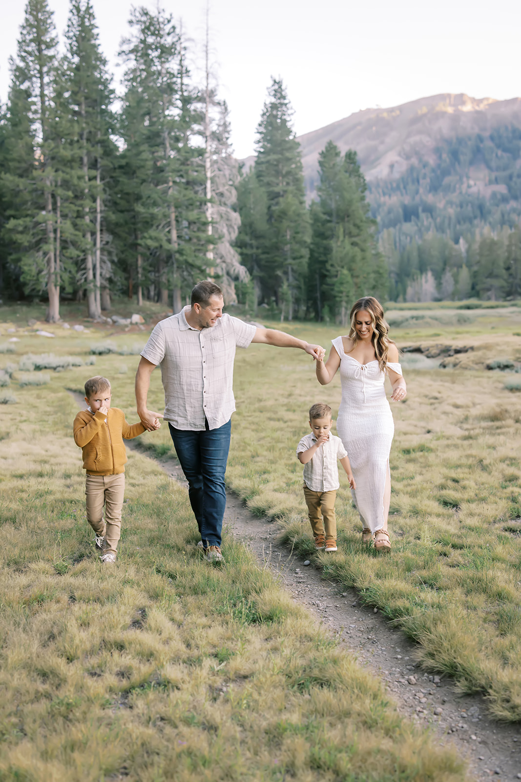 family of four walking in kirkwood meadows during a family photography session